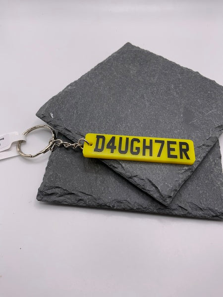 (261) D4ugh7er Keyring